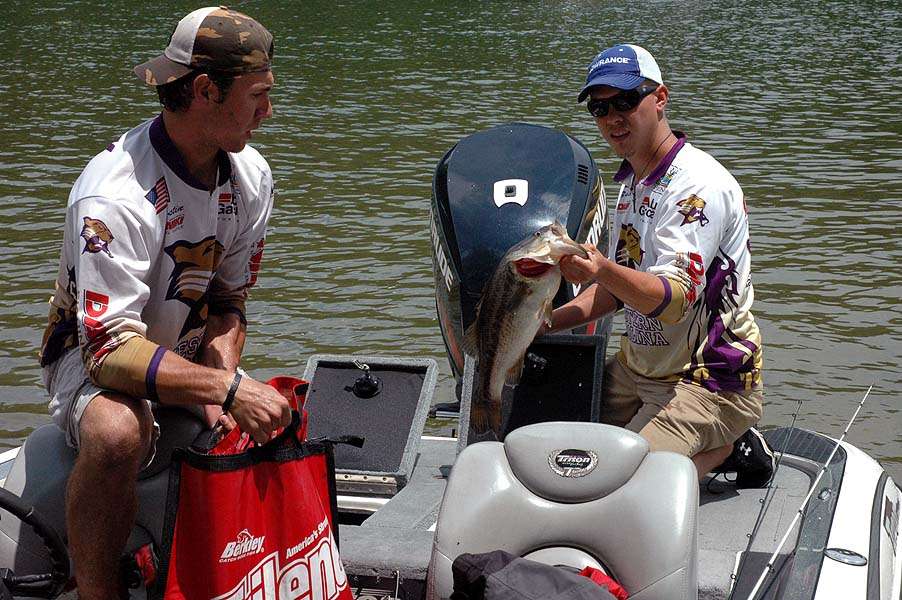 This largemouth, weighing 5 pounds 8 ounces, is held by Zach Hicks. Heâs joined by teammate Austin Neary of Western Carolina University. The bass is the Day 1 Carhartt Big Bass leader. 