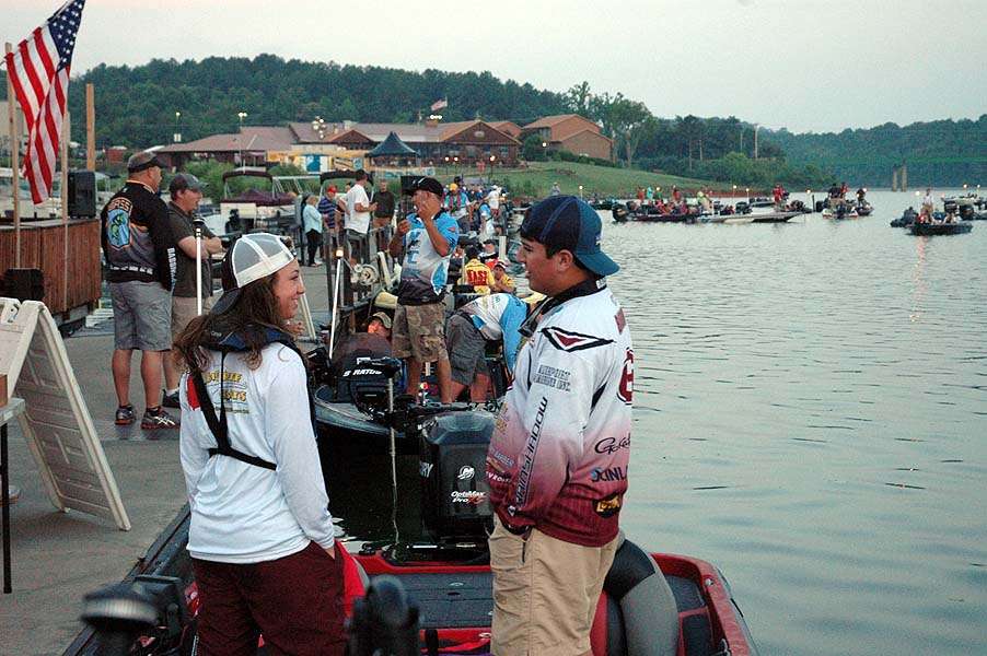 Teams discuss last-minute strategy before the day begins. 
