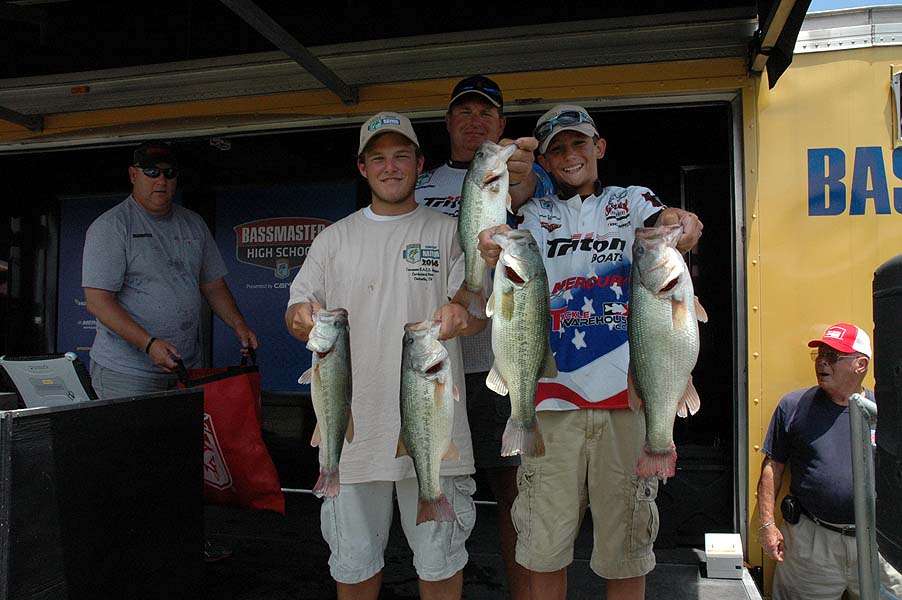 Elmer Smith and Hunter Silverstrim take second place with a 17-1 limit. Coach Eric Silverstrim stands behind them. 