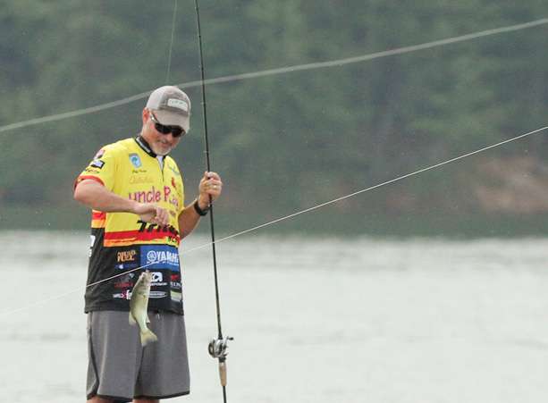 This one would not keep, but notice the fishing line running in front of him. One belongs to Lane, the other to KVD.