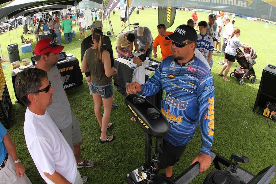 Michael Murphy talks over Minn Kota products with fans. 