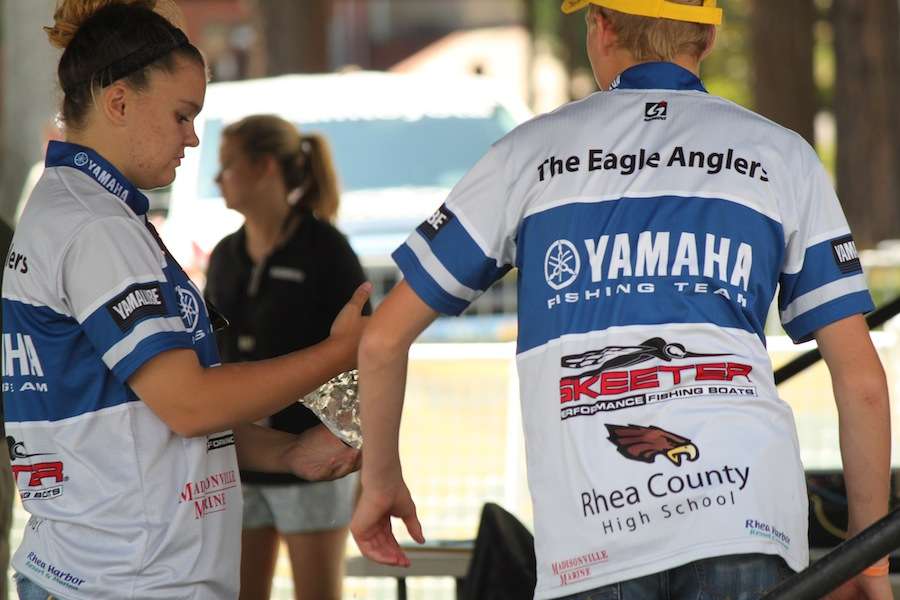 Rhea County High School anglers assist at weigh-in.