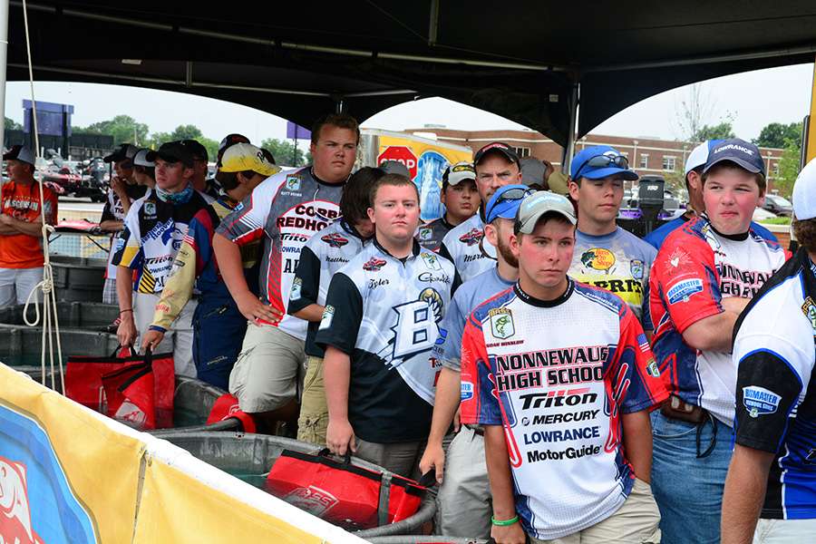 The anglers waiting at the tanks are figuring how much weight they might need to make the Top 10 cut.