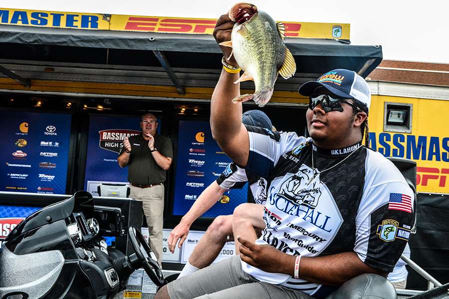 William Valdez holds up a good fish during the final day drive thru weigh-in.