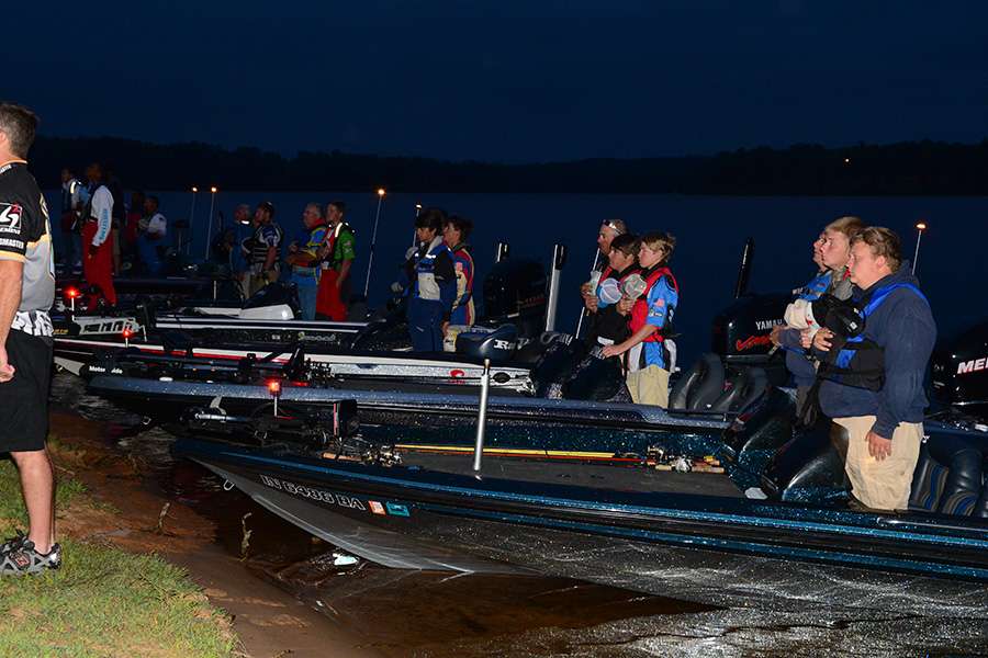 Anglers rise for the national anthem.