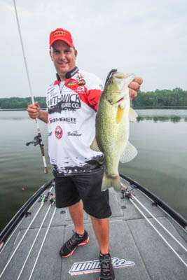 7:54 a.m. Prince bags his first bass of the day, 2-15, off a main-lake point on a Carolina rigged worm. 