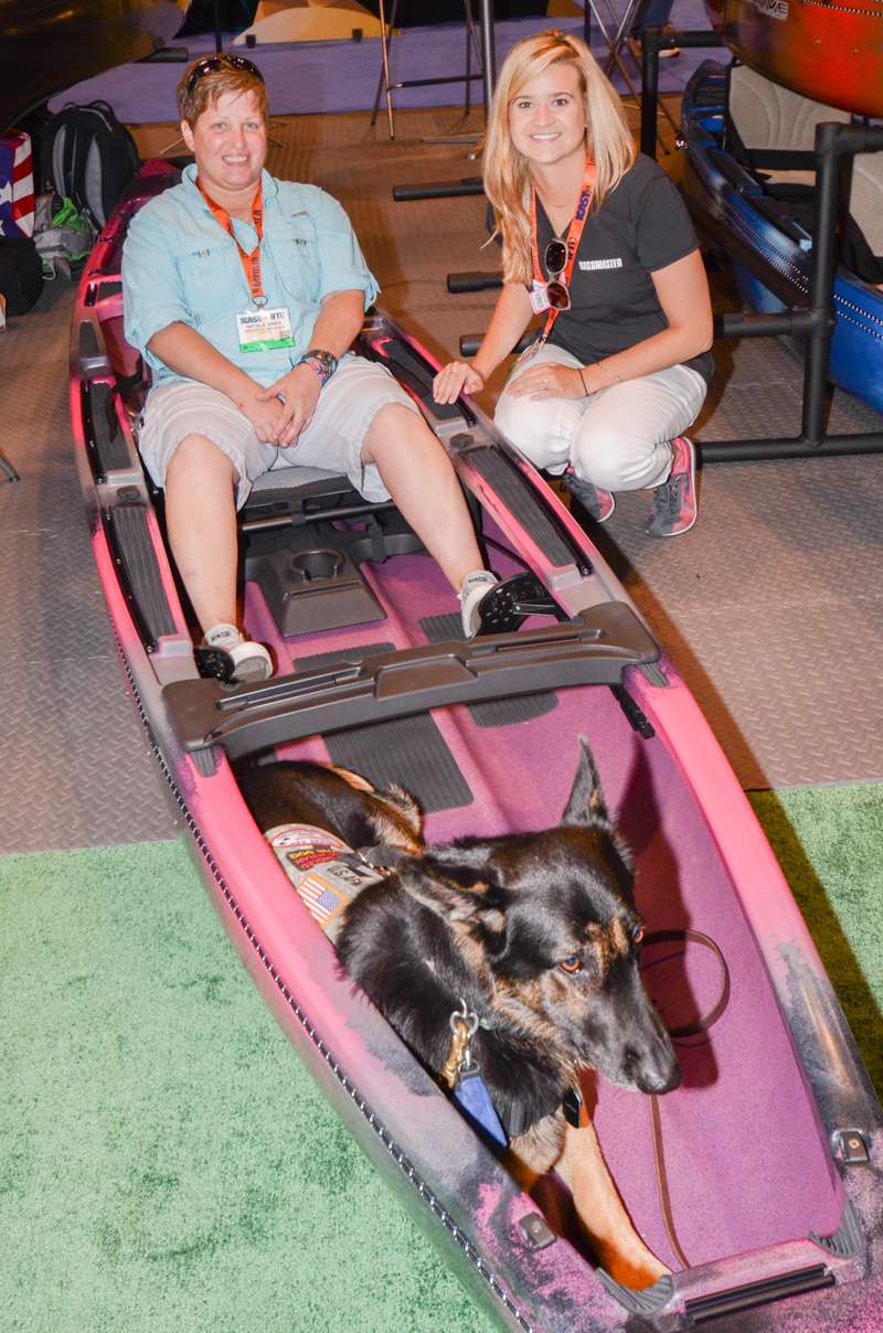 Natalie VInes, a member of Heroes on the Water, tests out the new Native Watercraft Ultimate Solo Angler kayak with her dog Captain.
