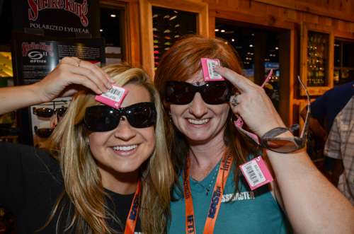 Strike King Lure Company debuts a new line of womenâs sunglasses. Tisdale and B.A.S.S. Communications Manager Helen Northcutt are happy to try them on.