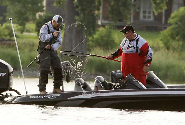 Co-angler Paul Blimkie boats a keeper fish with an assist from his Day 1 pro, Rob Grabow.  