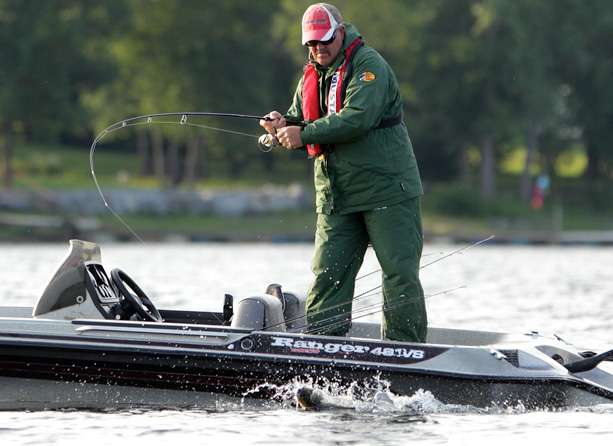 Co-angler Scott Dietrich fights a smallmouth into the boat. 
