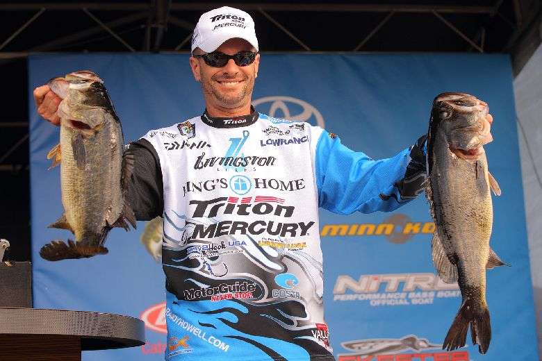 Blue is now the dominant color in Howell's tournament wardrobe. It looks good with big bass and with his Classic trophy.