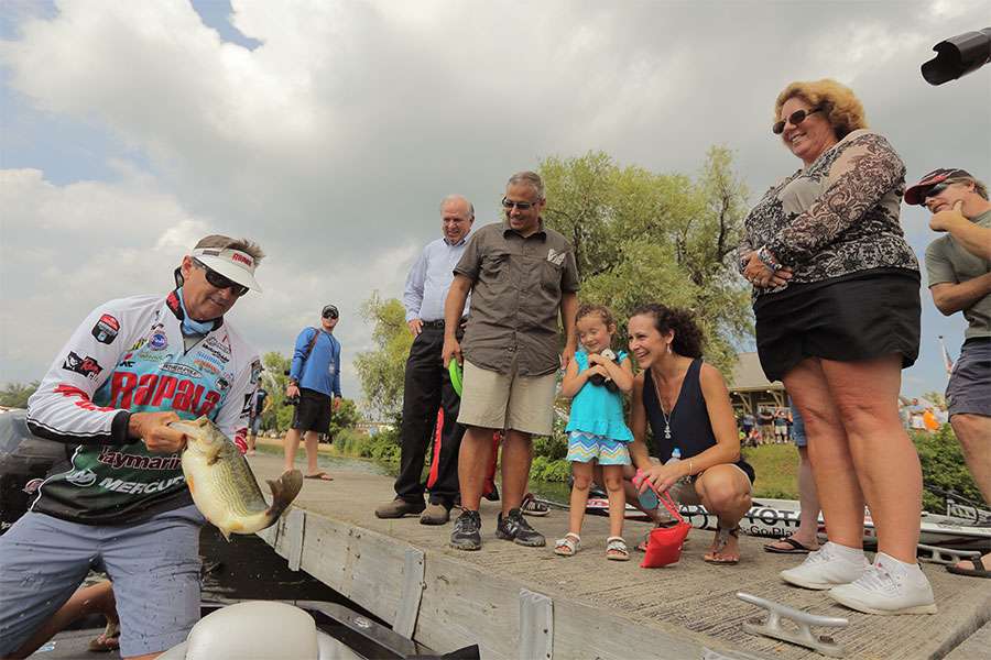 Bernie Schultz show off a nice fish to fans on the dock.