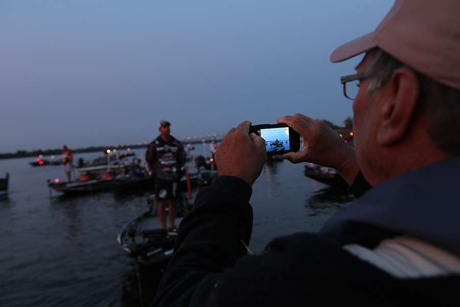 Spectators take pictures of their favorite anglers.
