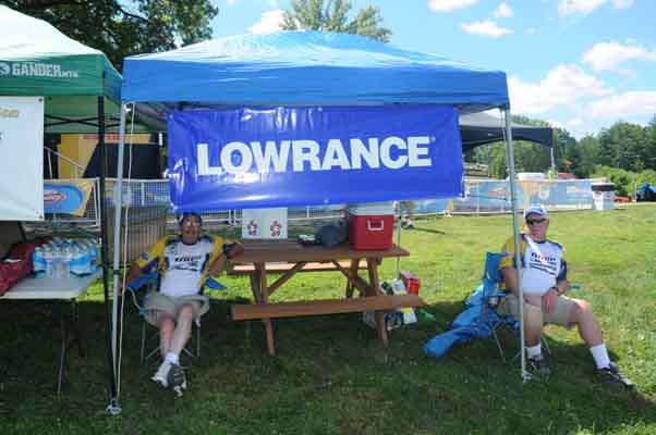 David Demott and Paul Wagner wait in the shade for the weigh-in to begin.