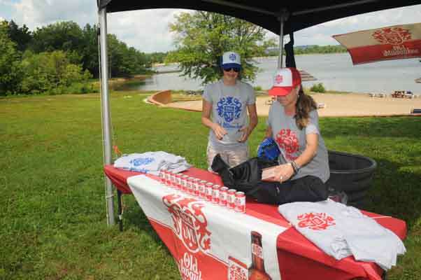 Shannon Nardi and Morgan Harrison set up the Old Milwaukee hospitality tent for the weigh-in and a beach party.