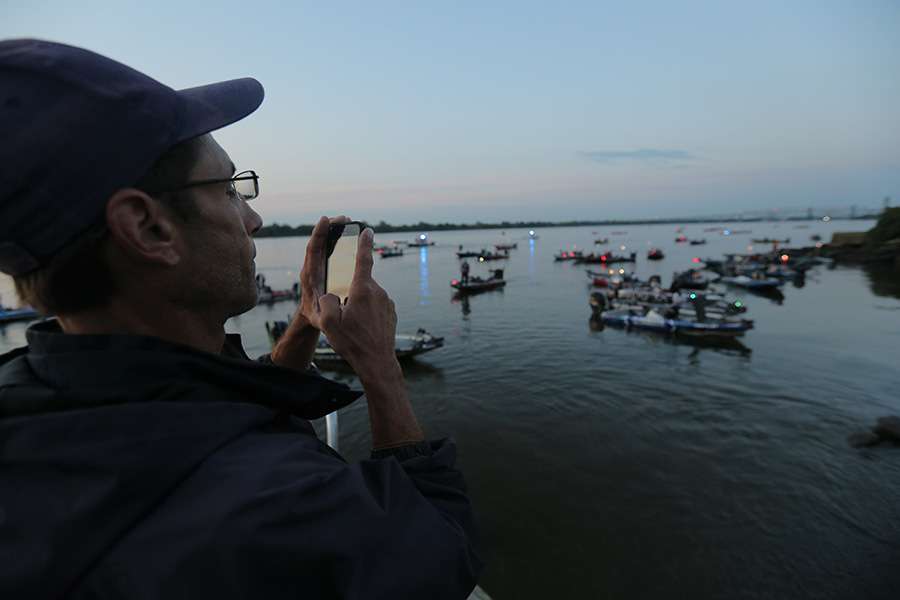 Spectators take pictures of their favorite anglers.