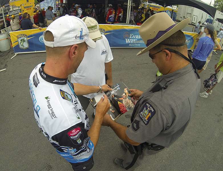 Howell even signs an autograph to a police officer.