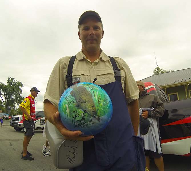 Bassmaster Marshal Danny Stafursky shows off a unique bowling ball that the Elite Series anglers signed for him. One side has smallmouthâ¦