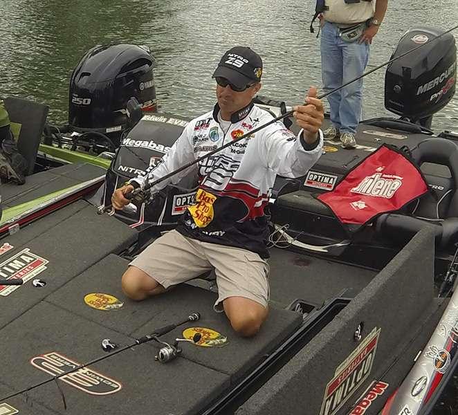 Edwin Evers stows his tackle before weighing his fish.