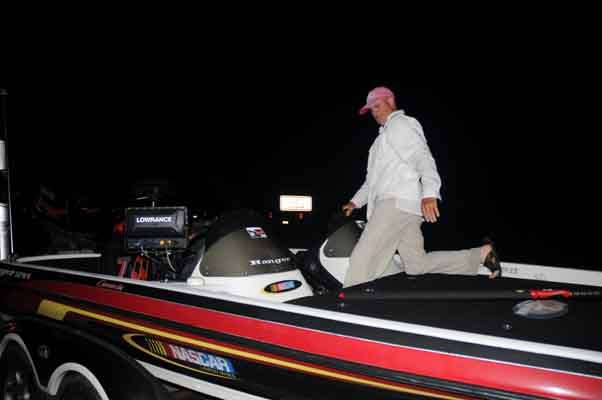 Larry Krohn hops aboard his boat.
