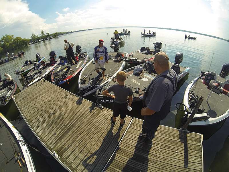 Scott Rook talks with spectators on the dock.