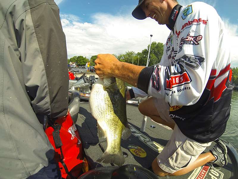 The beast of a fish anchors his 19-pound bag.