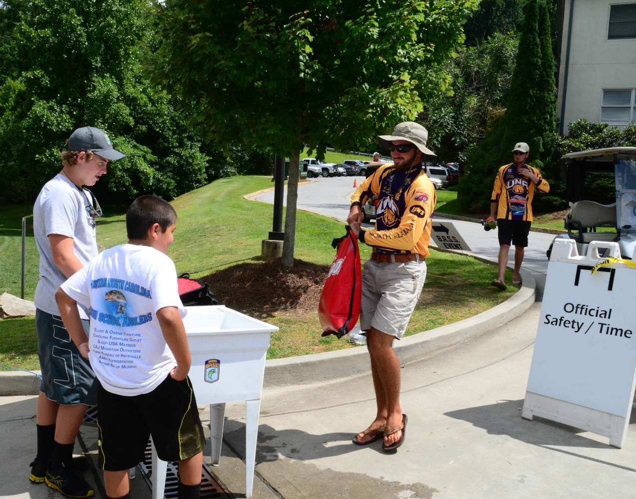 Hayesville High School club volunteers then meet the anglers at the entrance to the weigh-in â¦