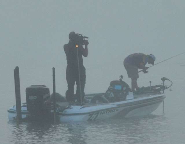 Bethel University's Zack Parker readies his Lowrance graph in the early morning fog.