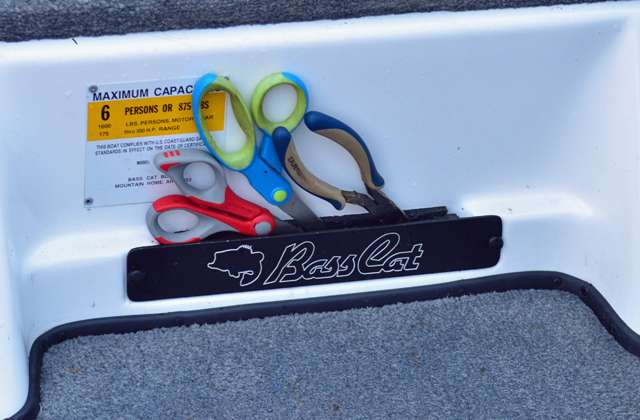 Scissors and other cutting devices ride in a handy holder.