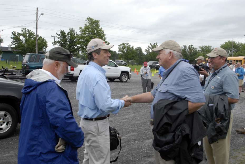 Gov. Andrew M. Cuomo is greeted by Don Logan and Bruce Akin of B.A.S.S. at the Bassmaster Governorâs Challenge tournament on Owasco Lake.