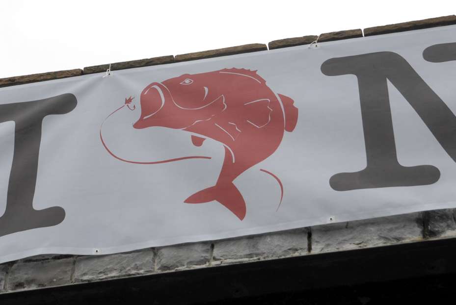 The iconic red heart replaced by a leaping bass was a theme in promotions of fishing tourism.