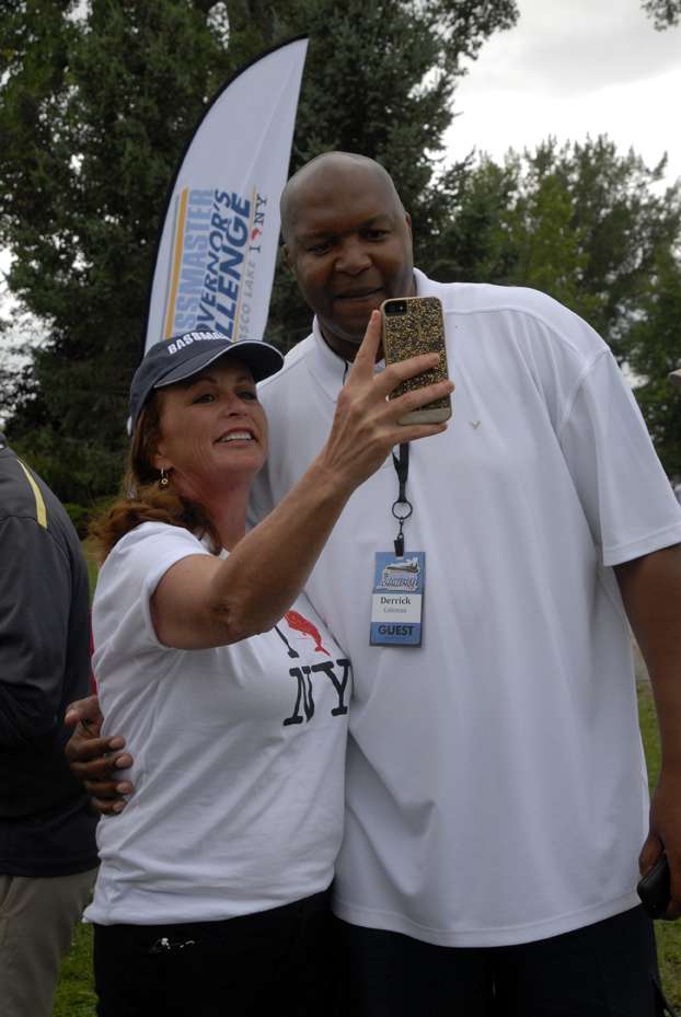 Angie Thompson, B.A.S.S. vice president of Event Sales and Sponsor Activation, poses for a âselfieâ with Derrick Coleman, former NBA and Syracuse University basketball star.