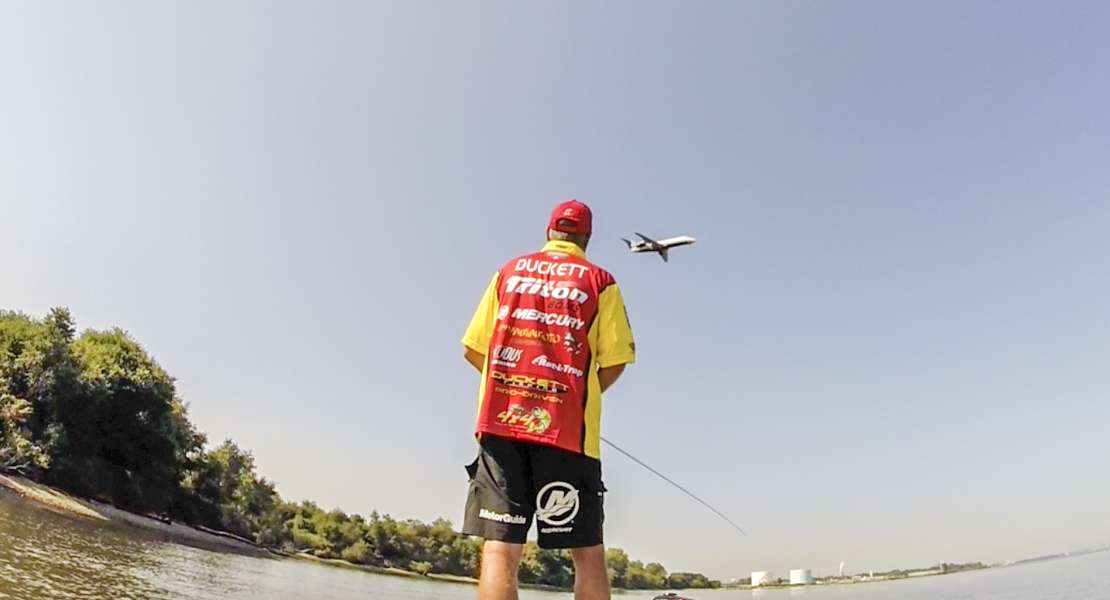 Boyd Duckett watches as a plane flies by, a regular occurrence on the Delaware. 
