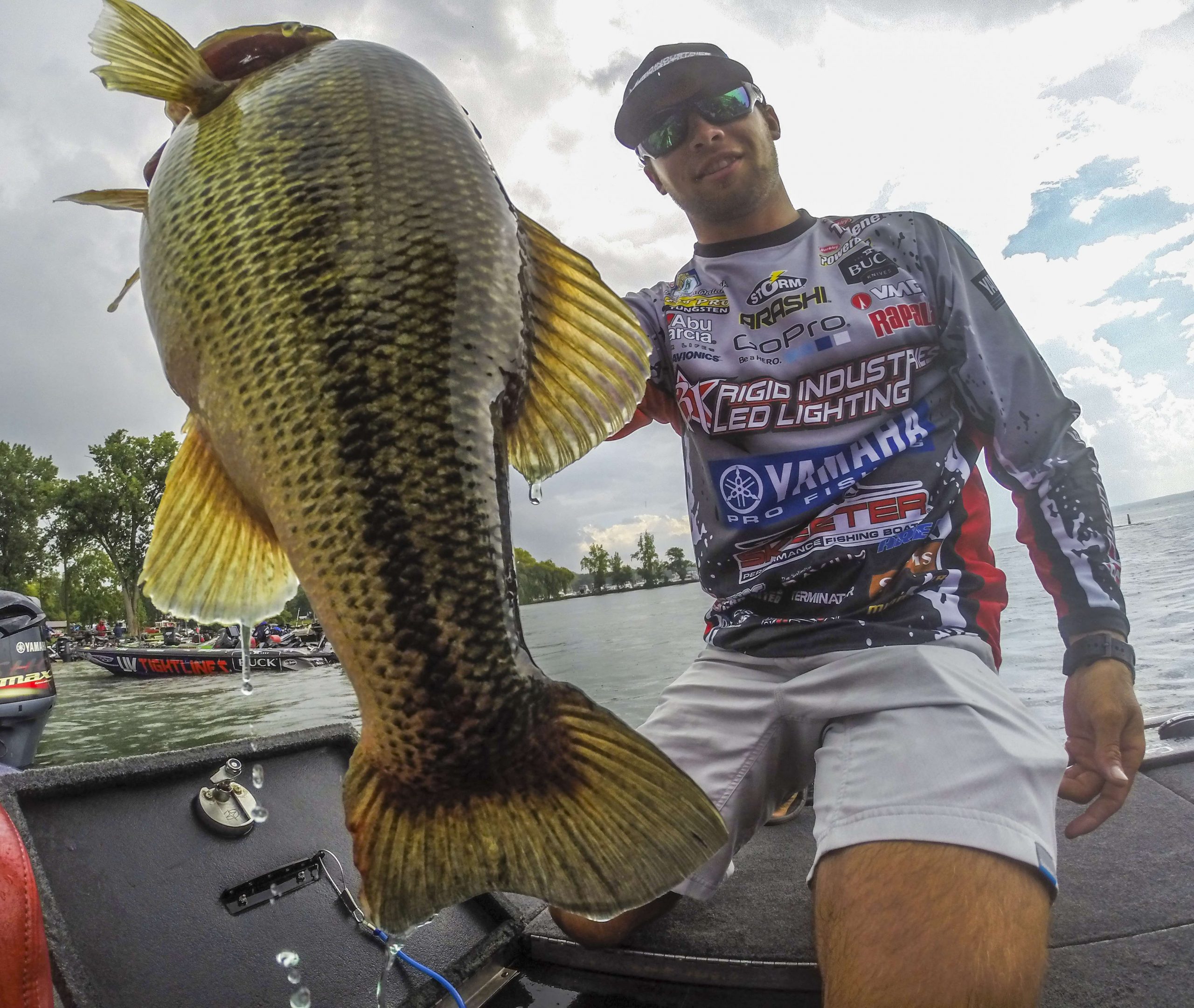 Photographer Garrick Dixon shares his favorite photos from the A.R.E. Truck Caps Bassmaster Elite on Cayuga Lake. Here's Brandon Palaniuk showing off a catch.