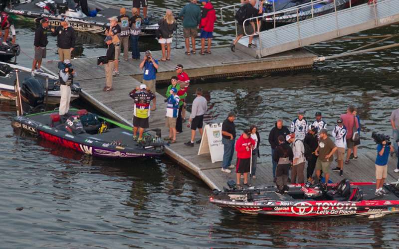 Michael Iaconelli (foreground) visits with friends as the anglers wait for the 6:15 a.m. start.