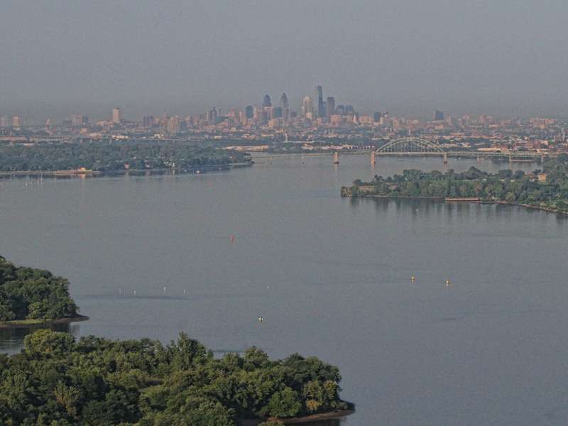 The mouth of the creek opens up to the Philadelphia skyline.