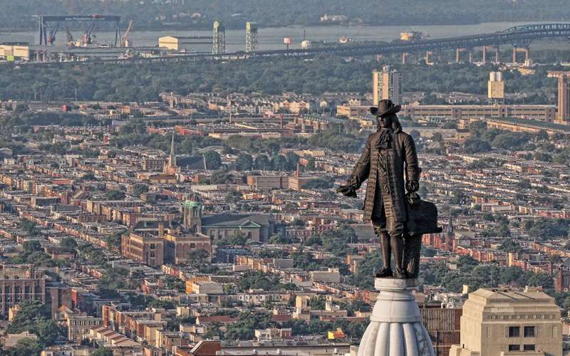 In downtown, William Penn, city founder, watches over the city and the Delaware River atop Philadelphia City Hall.
