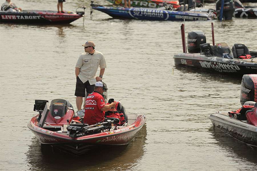 Cliff Prince stows his tackle as he wait for a open spot to park his boat.