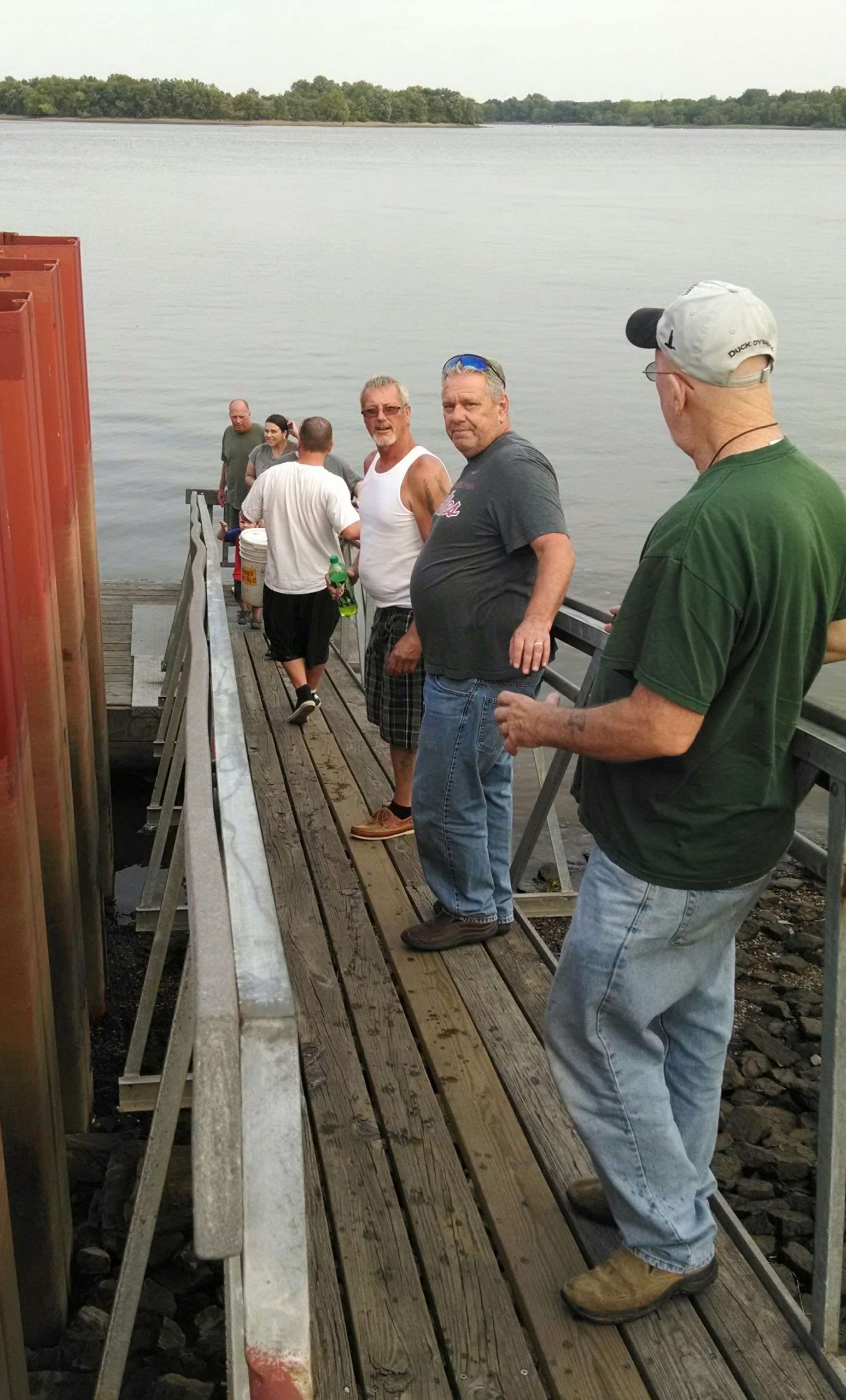 And then, something really unexpected happened: A group of local anglers formed a bucket brigade line down the walkway to the floating fishing dock to help!