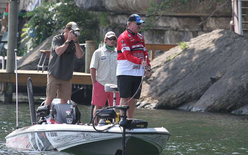 Davis would skip and pitch docks, while his Marshal and David Hunter Jones of Bassmaster.com watches the action.