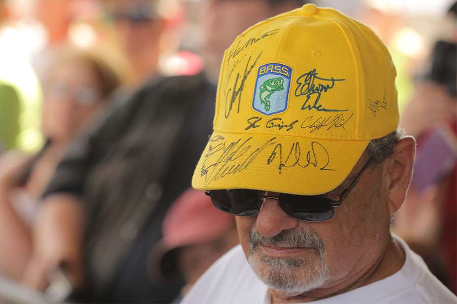 A volunteer with signed hat.