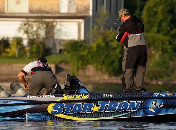 Patrick Pierce fights a fish to the boat while Frank Sipple waits with the dip net. 