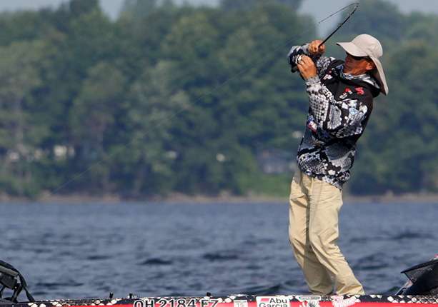 The next sequence of photos show Charley Hartley fighting a keeper smallmouth to the boat. 