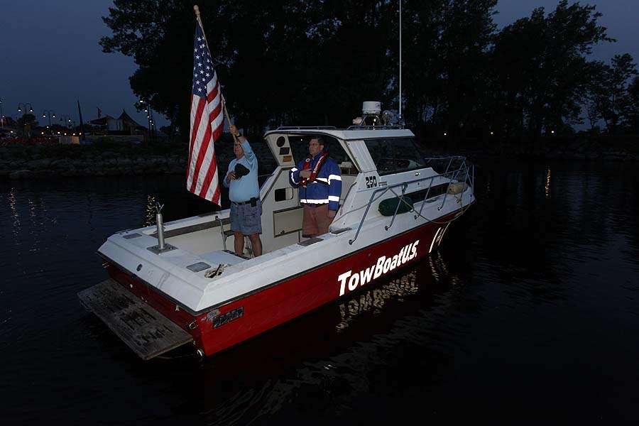 The national anthem is played with the flag held high aboard TowBoatU.S.