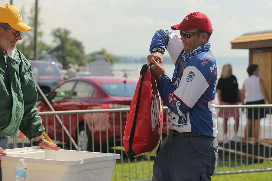 James Niggemeyer brings his fish to the weigh-in area.