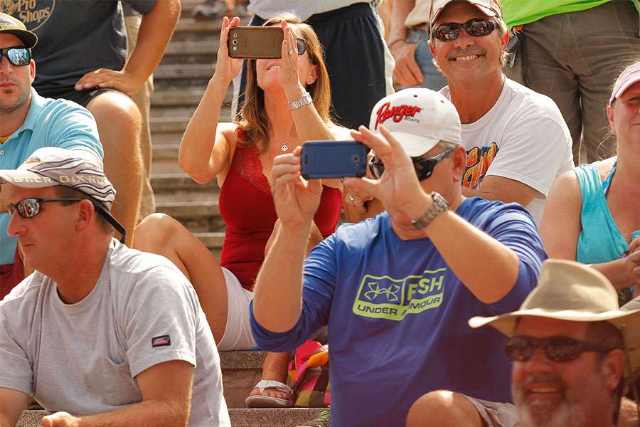 Fans take photos of their favorite anglers.