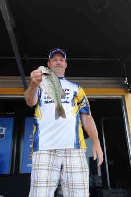 Steve Ohst of Michigan shows the crowd a spotted bass he caught.