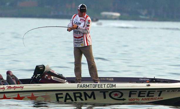 Follow along with B.A.S.S. photographer James Overstreet as he captures the pros on the water Day 2 of the A.R.E. Truck Caps Bassmaster Elite on Cayuga Lake. Here's Andy Montgomery.