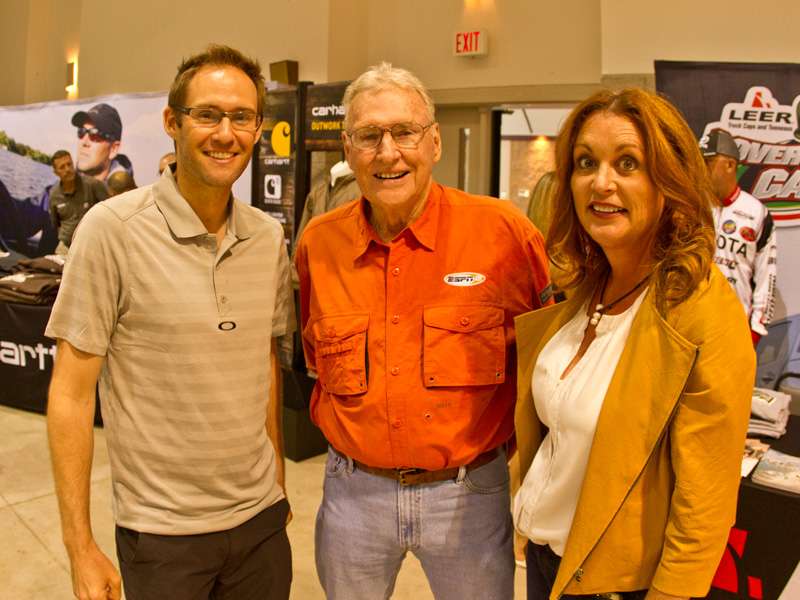 Phil Teeple of Toyota and Jerry McKinnis and Angie Thompson of Bassmaster pose for a photo.