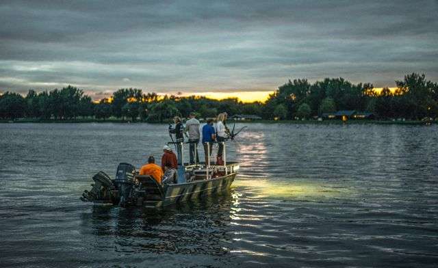 As the sun sets on Owasco Lake, it's time to turn on the bank of lights on the bow and start looking for carp. 